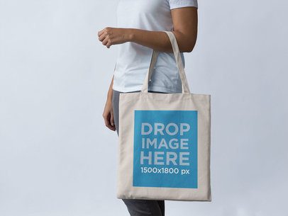 Mockup of a Tote Bag Being Carried on an Arm
