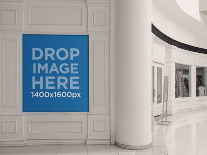 Poster Mockup Placed on a White Wall Inside a Mall