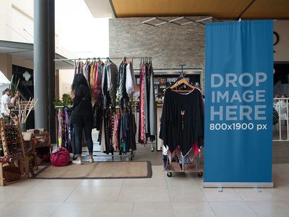 Roll-Up Banner Standing Next to a Boho Clothing Bazar a11271