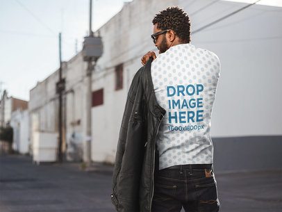 Back of a Man wit Curly Hair Wearing a T-Shirt on the Street