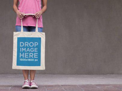 Tote Bag Mockup Carried by a Young Woman in the Street