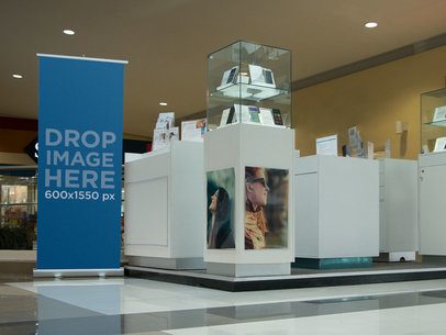 Mockup of a Roll-Up Banner at Cellphone Stand in a Mall a11297
