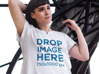 T-Shirt Mockup of a Young White Woman in an Urban Space