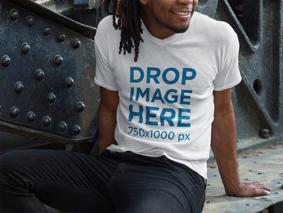 V-Neck T-Shirt Mockup of a Smiling Man With Locs Sitting