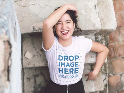 Mockup of a Smiling Asian Woman Wearing a Tee and Grabbing Her Hair