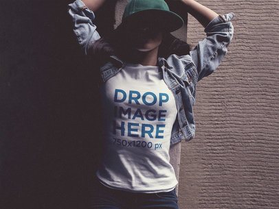 Tee Mockup of a Trendy Woman Wearing a Hat and Lying on Her Back 