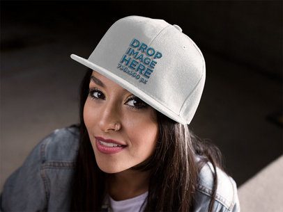 Snapback Mockup Featuring a Young Hispanic Woman Smiling