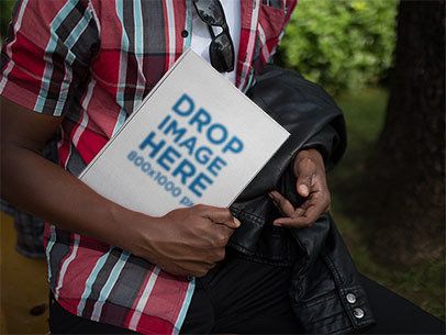 Hardcover Book Mockup Held by a Young Black Man a12034