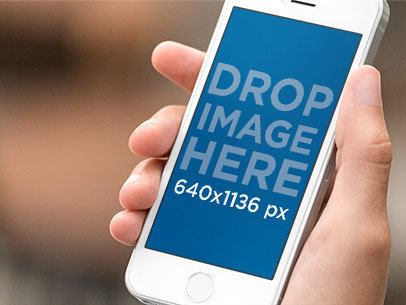 Angled iPhone SE Mockup in a Woman's Hand a12260