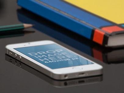 iPhone SE Mockup Lying on a School Desk a12256