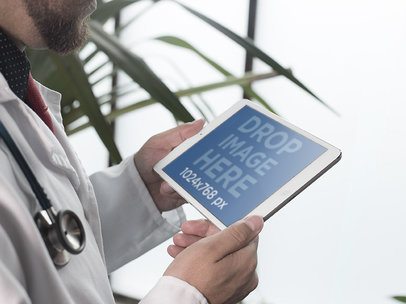 iPad Mockup in Landscape Mode of a Male Doctor Next to a Plant 12397