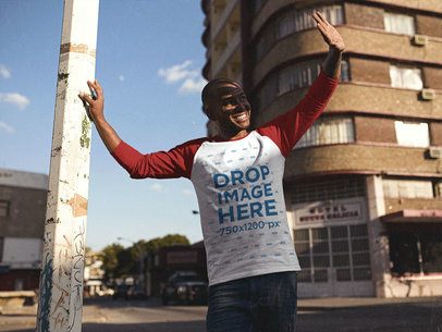 Smiling Young Black Man Looking at the Sun in his Raglan T-Shirt Mockup a12546