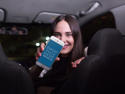Mockup of a Woman in a Car Showing Her iPhone 7
