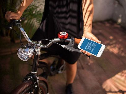 Woman on her Bike with an iPhone 7 in Portrait Position Mockup