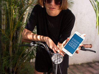 Mockup of a Woman in a Bike Showing Her iPhone Screen