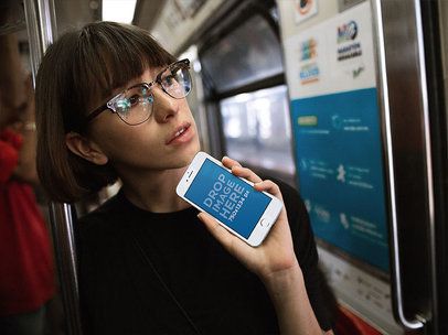 White iPhone 6s Mockup of a Woman on the Metro Checking a Map a12961