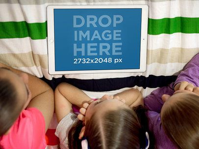 Three Little Girls Using an iPad Pro in their Room Mockup a12996