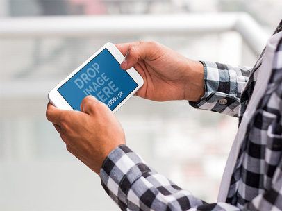 iPhone Mockup in Landscape Position Featuring a Man 