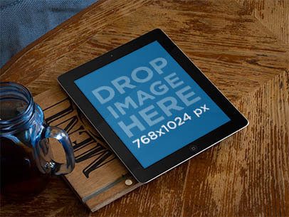 Mockup of an iPad Placed on a Restaurant Table 