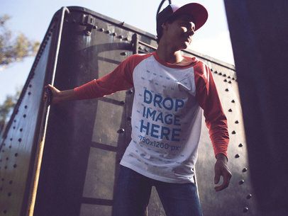 Trendy Young Man Holding onto a Train Wagon Raglan Tee Mockup a12515