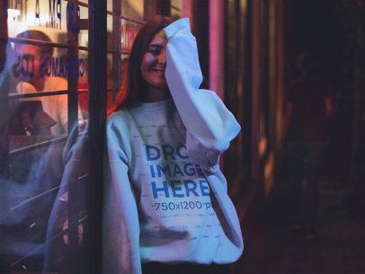 Pretty Woman with Long Hair Wearing a Crewneck Mockup and Covering Half her Face
