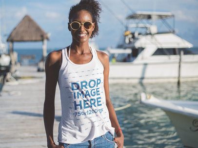  Mockup of a Young Woman Wearing a Beach Tank Top by the Yacht Pier 