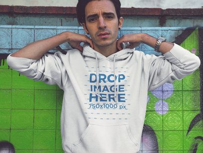 Pullover Hoodie Mockup of a Cool Guy in an Abandoned Swimming Pool a12835