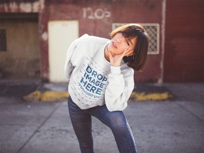Crewneck Sweatshirt Mockup of a Woman with Short Hair Leaning on her Knee