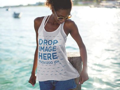 Mockup of a Young Woman at the Beach Wearing a Tank Top 12740
