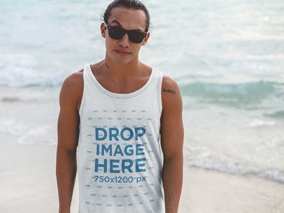 Men's Tank Top Mockup of a Cool Guy Wearing Sunglasses at the Beach