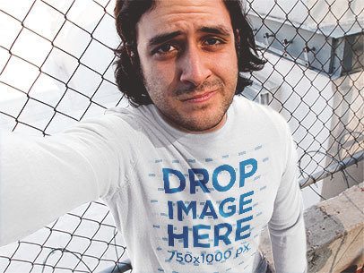 Man with Long Hair Wearing a Long Sleeve Tee and Taking a Selfie Mockup