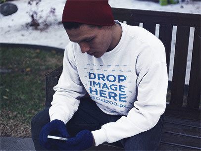 Young Man Texting Out in the Snow Crewneck Sweatshirt Mockup