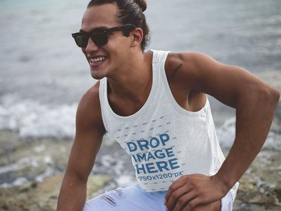 Young Guy with Long Hair Wearing a Beach Tank Top Mockup at the Shore