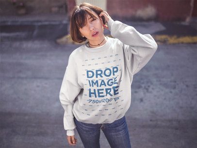 Trendy Short Haired Girl Standing in a Street Wearing a Crewneck Sweatshirt Mockup a12673