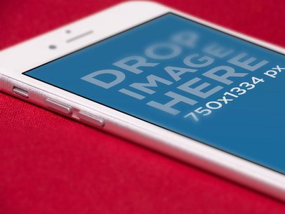 iPhone Angled Close Up Mockup Lying Over a Red Surface