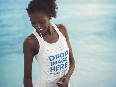 Tank Top Mockup of a Young Woman Smiling at the Beach