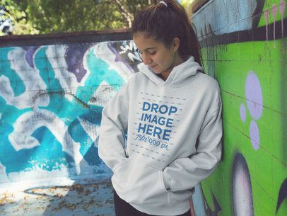 Hoodie Mockup of a Young Woman with a Ponytail Looking Down