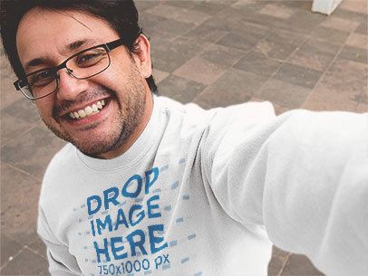 Mockup of a Smiling Man Wearing a Crewneck Sweatshirt and Taking a Selfie