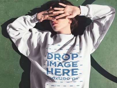 Short Haired Girl Lying in the Sun Wearing a Crewneck Sweatshirt Mockup a12669