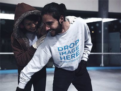 Young Man Playing with his Girlfriend at a Skating Rink Wearing a Crewneck Mockup a13250