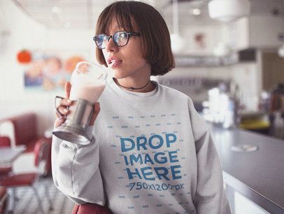 Asian Girl with Glasses Sipping on a Milkshake at a Diner Crewneck Mockup b12666