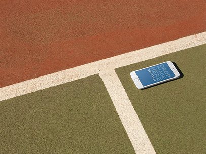 Mockup Of White iPhone 6 Lying On A Tennis Court a14096
