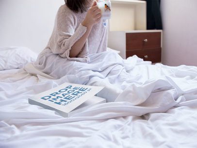 Mockup of a Book Lying on a Womans Bed While Shes Drinking a Coffee in the Morning