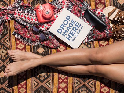 Mockup of a Book Lying Near a Woman's Legs and Her Accessories While at the Beach