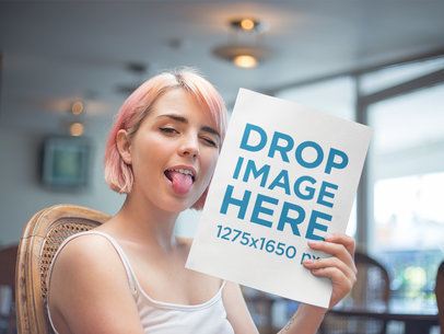 Girl With Pink Hair Holding a Magazine While Making a Funny Face Mockup a14373