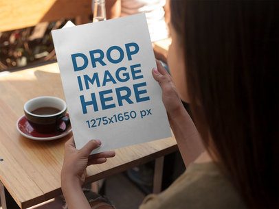 Over Shoulder Mockup of a Young Girl Holding a Magazine in a Hot Day While Having a Coffee a14338