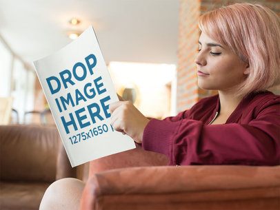 Young Pretty Girl With Short Pink Hair Reading a Magazine While Sitting on an Armchair Template a14363