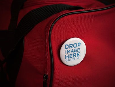 Mockup With a Button on a Red Gym Bag 