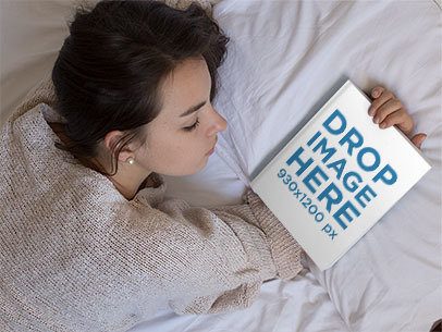 Young Girl Holding a Book on her Hand While Lying Down on her Bed Mockup a14275