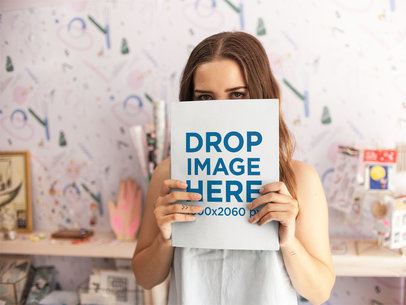 White Woman With Green Eyes Holding a Big Book While Standing Mockup